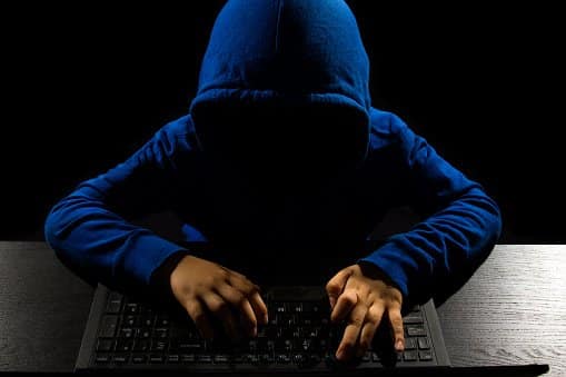 Faceless Hacker using computer - Cybersecurity